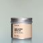 A container of Old Money Beard Balm against a grey background.