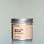 A container of Tree Ranger Beard Balm against a grey background.