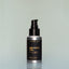 A bottle of Bold Fortune travel-size Beard Oil with a pump dispenser against a grey background.