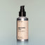 A bottle of Old Money full-size Beard Oil with a pump dispenser against a grey background.