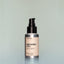 A bottle of Tree Ranger travel-size Beard Oil with a pump dispenser against a grey background.