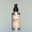 A bottle of Tree Ranger full-size Beard Oil with a pump dispenser against a grey background.