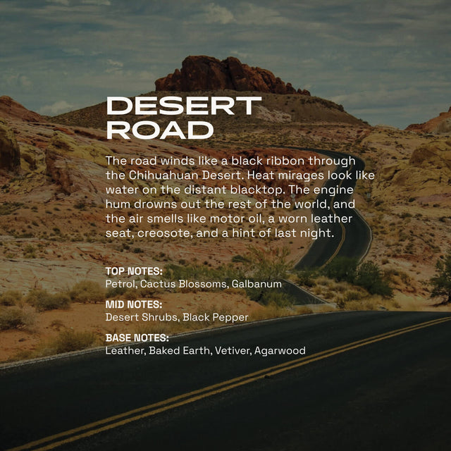 Desert Road fragrance graphic showing a winding blacktop road through a rocky desert landscape under a pale sky. Text describes the scent as a dry, rugged desert blend with notes of petrol, cactus blossoms, galbanum, desert shrubs, black pepper, leather, baked earth, vetiver, and agarwood.