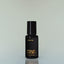 A bottle of Four Vices Eau de Parfum against a grey background.