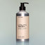 A bottle of Temple Smoke Utility Wash with a pump dispenser against a grey background.