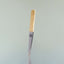 The slant tip Beardbrand Tweezers with two-tone stainless steel and the Beardbrand circle logo.