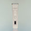 The Beardbrand Utility Trimmer with a sleek design. It features a metal trimming head, a power button, and a small digital display on its body.